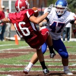 CSC’s Kramer Hirz, (16) senior safety of Casper, Wyo., blocks a punt in front of Mary’s inside line backer Luke Senger, junior of Bismarck, N.D.