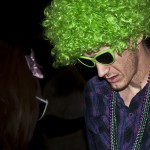 Julian Lykins, sophomore of Chadron, shows his "80s flair" by wearing a neon-green wig at the Pit's 80s Dance Thursday.— Photo by T.J. Thomson Julian Lykins, sophomore of Chadron, shows his "80s flair" by wearing a neon-green wig at the Pit's 80s Dance Thursday.— Photo by T.J. Thomson