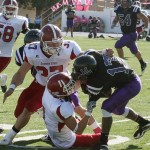 Chadron State's Jed Herblan (1) and Kelen Kahrs (37) tackle New Mexico Highlands' wide receiver, Marcus Washington (17), during the game Saturday in Las Vegas, N.M. — Courtesy photo
