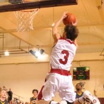 Kevin McClelland (3), junior guard of Long Beach, Calif., dunks against Colorado Christian University Saturday in Armstrong Gym. — Photo by Kinley Q. Nichols