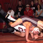 Chadron State’s Dustin Stodola, sophomore of Clarkson, bottom, attempts to push off Mesa State’s Tyler Nelson, sophomore of Highlands Ranch, Colo., top, in the 133-pound match on Thursday in the Nelson Physical Activity Center. &mdash; Photo by Kinley Q. Nichols