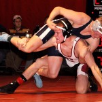 CSC's Mikah Kadera, junior of Sheridan, Wyo., maneuvres against Dickinson (S.D.) State University's Kyle Johnson, junior of Mesquite, Nev., during their 157-pound match Wednesday night at the NPAC. &mdash; Photo by Kinley Q. Nichols