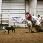 BoDelle Mueller, junior of Sutherland, ropes a calf in Torrington at the Eastern Wyoming College rodeo. Mueller placed third in the long go, won the short go, and placed second in the average. &mdash; Photo courtesy of Brian Gauck,of CSU