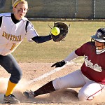Eagle’s Brittany Chacon, (24), junior of Broomfield, Colo., slides into third base as Viking’s Jenny Brown, (18), sophomore of Omaha waits to catch the ball during Tuesday’s game. &mdash; Photo by Kinley Q. Nichols