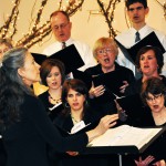 Una Taylor, associate professor of the music department, conducts the Chadron State Community Chorus during the Centennial Concert at the Chadron Arts Center Sunday. — Photo by Vera Ulitina