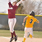 Chadron’s Amy Schartz (1), sophomore utility player of Brady, catches a wild throw as Kyley Barela (3), sophomore second baseman of Utica, S.D., runs through first base during Wednesday’s game against Black Hills State University. — Photo by Kinley Q. Nichols