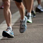 A pair of legs pound the pavement during the 2011 Bolder Boulder 10k marathon Monday. An estimated 56,000 participants ran the race.