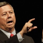 Dave Heineman, governor of Nebraska, motions with his hands during the keynote address of the State Colleges Conference Friday afternoon in the auditorium of Memorial Hall. — Photo by T.J. Thomson