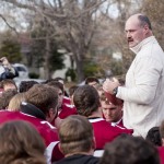 Former Head Coach Bill O’Boyle speaks to the football team, alumni players, and community members on his front lawn Saturday after the game against Colorado Mesa University- Photo by Kinley Q. Nichols.