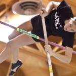 Kaelie Jelden, 20, junior of Greeley, Colo., pushes her body above the cross bar during Thursday’s intrasquad meet. Jelden’s highest jump cleared was 10-feet, six inches- Photo by Kinley Q. Nichols.