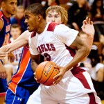 Forward Josh Hatcher (front), junior of Oakland, Calif., keeps the ball from Alex Dorr (back), junior of Norwalk, Iowa, during a game in Armstrong Gymnasium Nov. 15, 2011. — Photo by T.J. Thomson