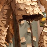 Senior Timm Hoff’s The Post-It Man; Mixed Media piece; would like to tell you about the way it’s disappearing in Memorial Hall. — Photo by Kinley Q. Nichols