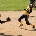 Senior second base Brittany Chacon of Broomfield, Colo., (left) prepares to catch the ball as an Augustana player (right) approaches second base on Tuesday in Sioux Falls, S.D. — Photo by Karisa Lamle