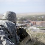 Cadet Cristian Salazar, junior of Grand Island, keeps watch south of campus from the top of C-Hill on April 4. &mdash; Photo by Kinley Q. Nichols