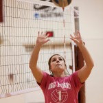 Alyssa Bauer, freshman of Rapid City, S.D., sets the ball during practice Tuesday in the Armstrong Gym. — Photo by T.J. Thomson