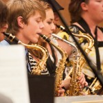 Drew Kasch, center, freshman of Highlands Ranch, Colo., sits among other saxophonists during the Jazz Band’s performance in the Student Center Ballroom Friday evening. &mdash; Photo by T.J. Thomson