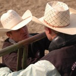 Bareback rider Collin Chytka, sophomore of Broken Bow, talks with coach Dustin Luper before competing in the   September 2012 Chadron State rodeo- Photo by Jennifer Parker.